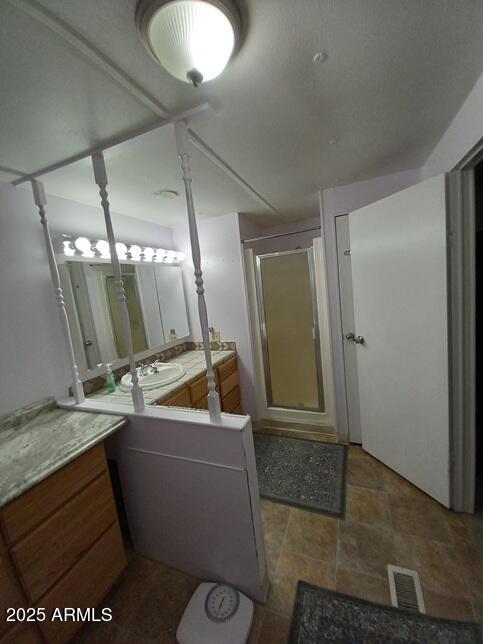 2100 North Trekell Road Casa Grande, AZ 85122 - Photo 11 of 21 a bathroom with a sink a toilet and mirror
