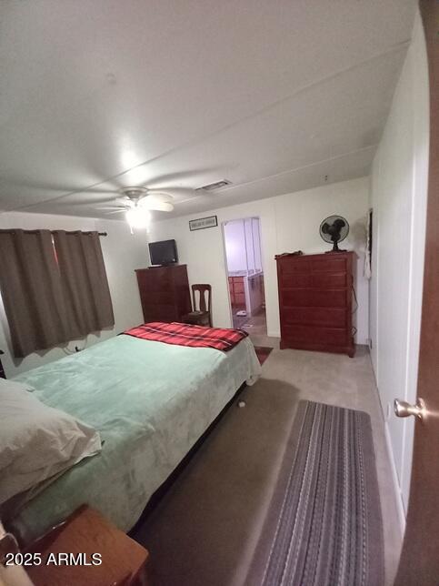 2100 North Trekell Road Casa Grande, AZ 85122 - Photo 12 of 21 a bedroom with a bed and a dresser