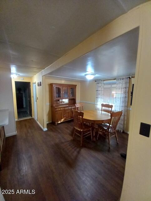 2100 North Trekell Road Casa Grande, AZ 85122 - Photo 6 of 21 a view of a dining room with furniture and wooden floor