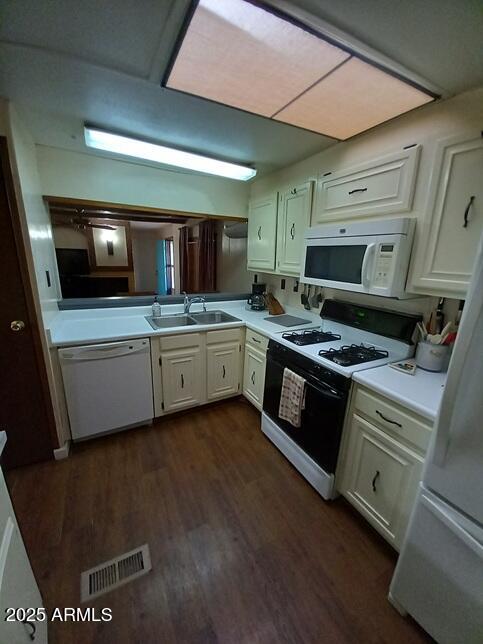 2100 North Trekell Road Casa Grande, AZ 85122 - Photo 9 of 21 a kitchen with stainless steel appliances a stove a sink and a microwave