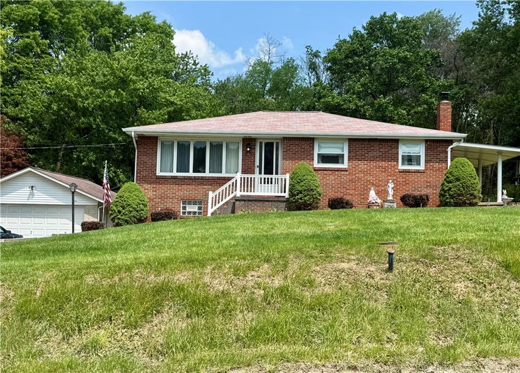151 Huntingdon Road Wyano, PA 15695 - Photo 1 of 36 a front view of a house with garden