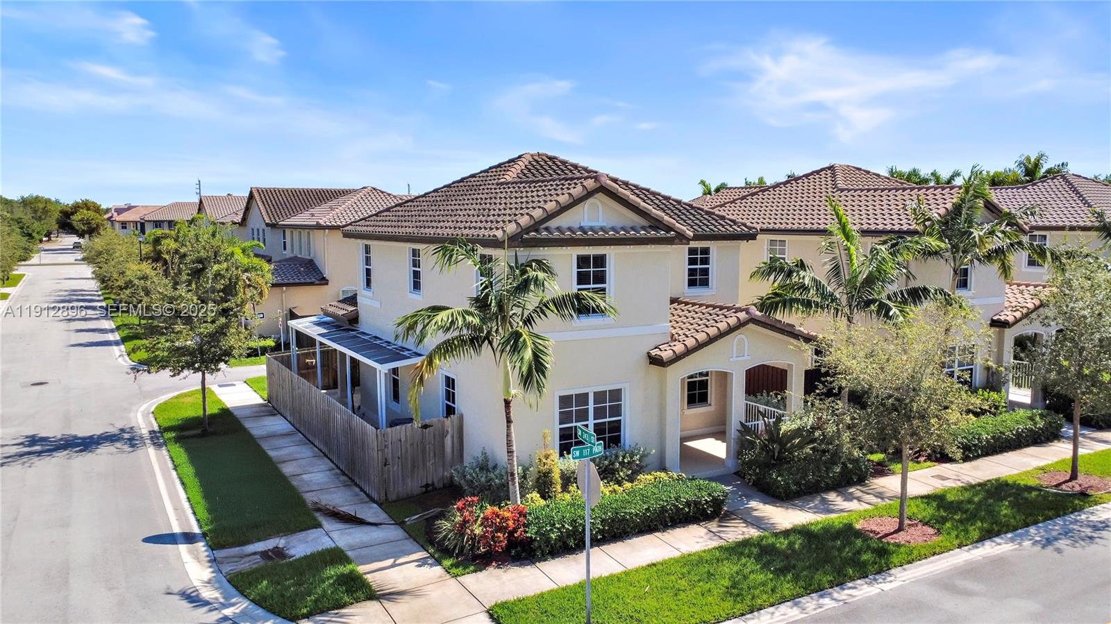 24301 Southwest 117 Path Homestead, FL 33032 - Photo 11 of 50 a front view of a house with a yard