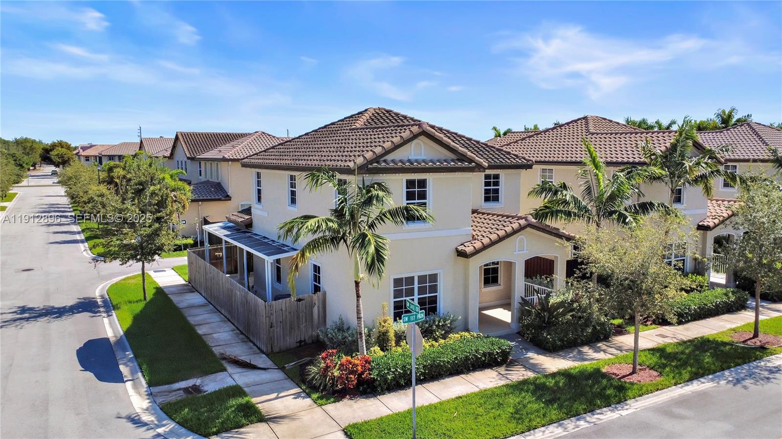 24301 Southwest 117 Path Homestead, FL 33032 - Photo 12 of 50 a front view of a house with a yard