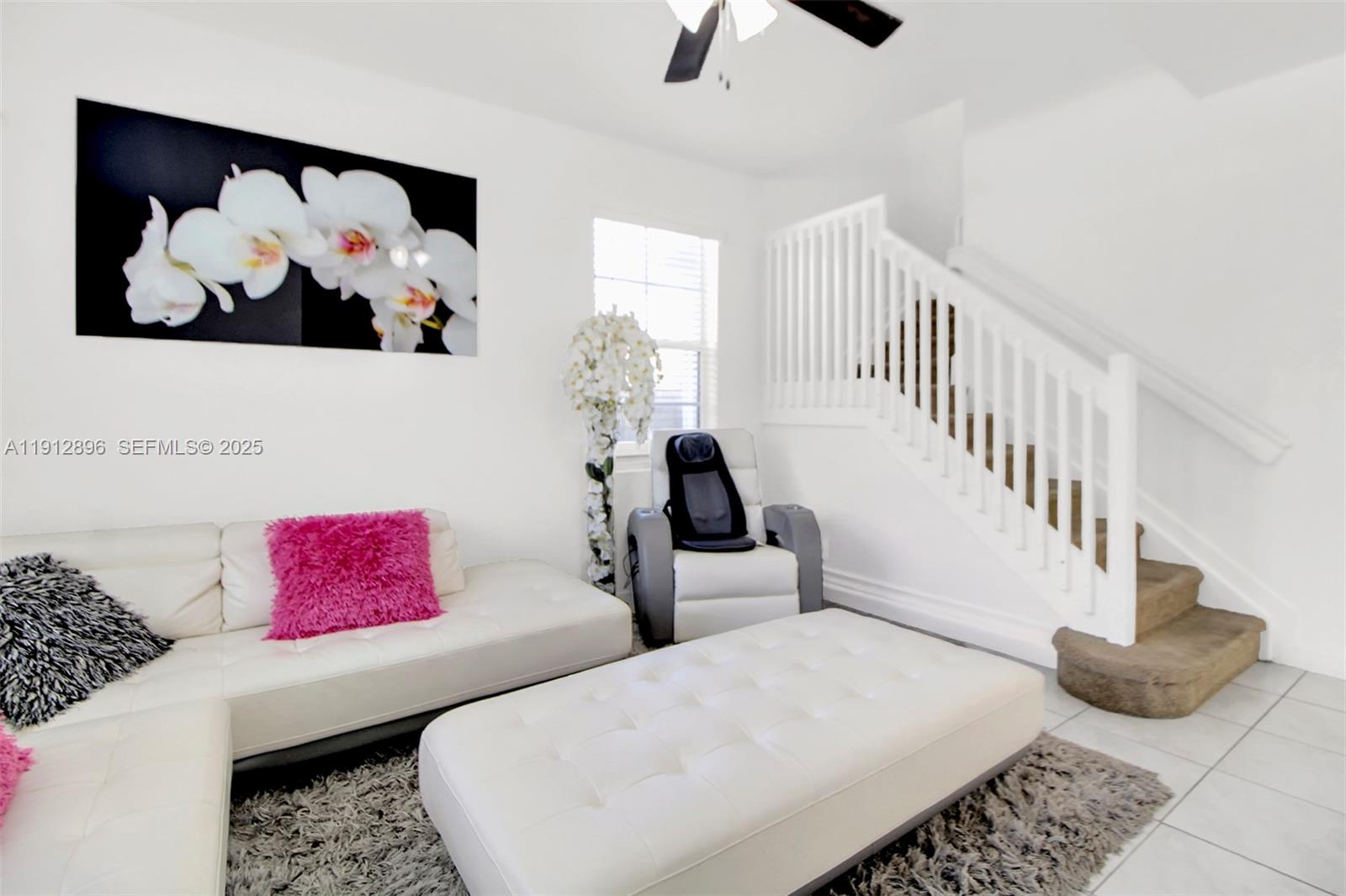 24301 Southwest 117 Path Homestead, FL 33032 - Photo 16 of 50 a living room with furniture and a painting on the wall