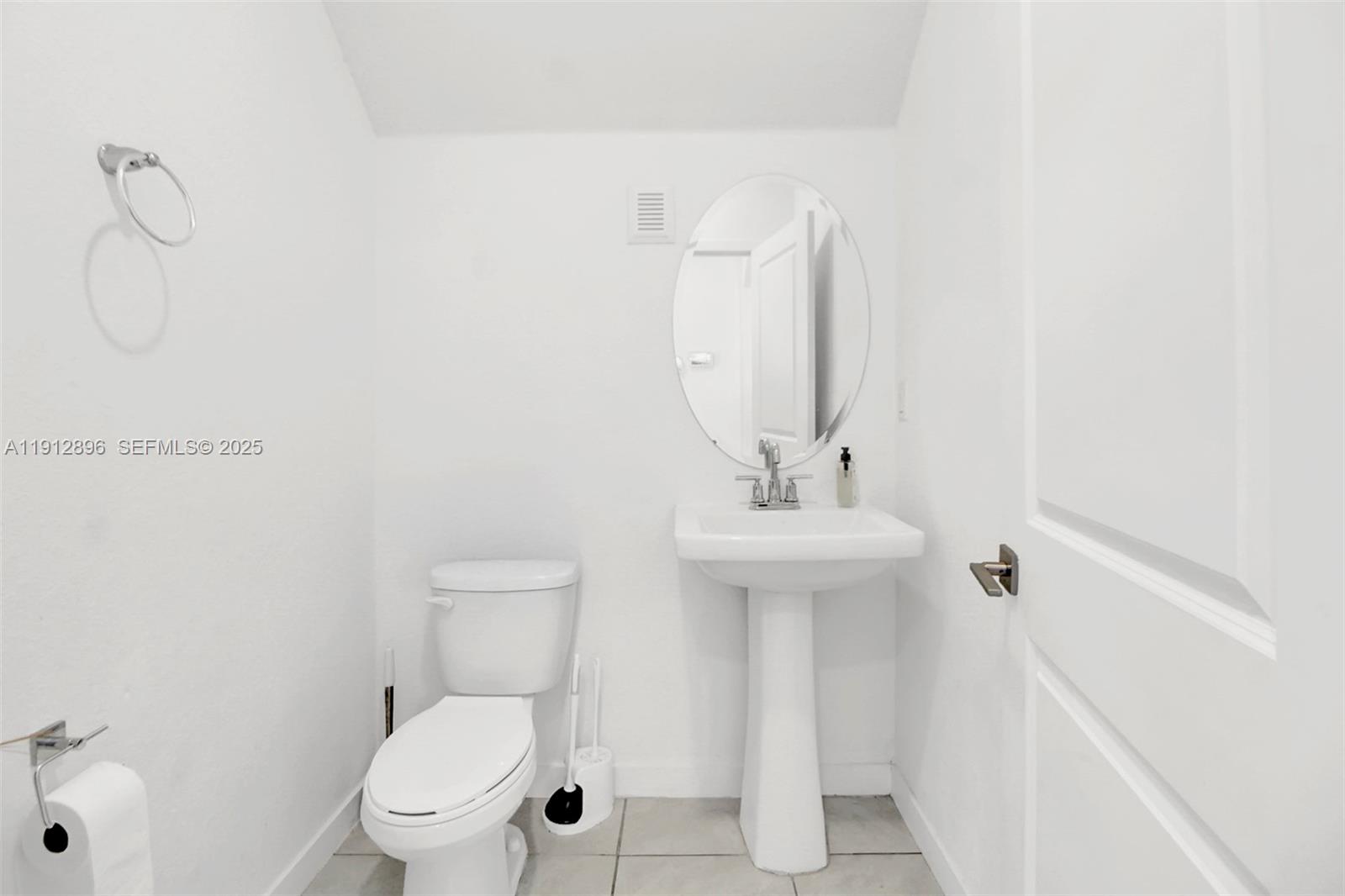 24301 Southwest 117 Path Homestead, FL 33032 - Photo 22 of 50 a bathroom with a toilet sink and mirror