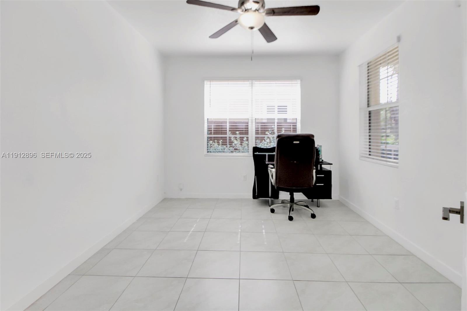 24301 Southwest 117 Path Homestead, FL 33032 - Photo 25 of 50 a view of workspace with furniture and windows