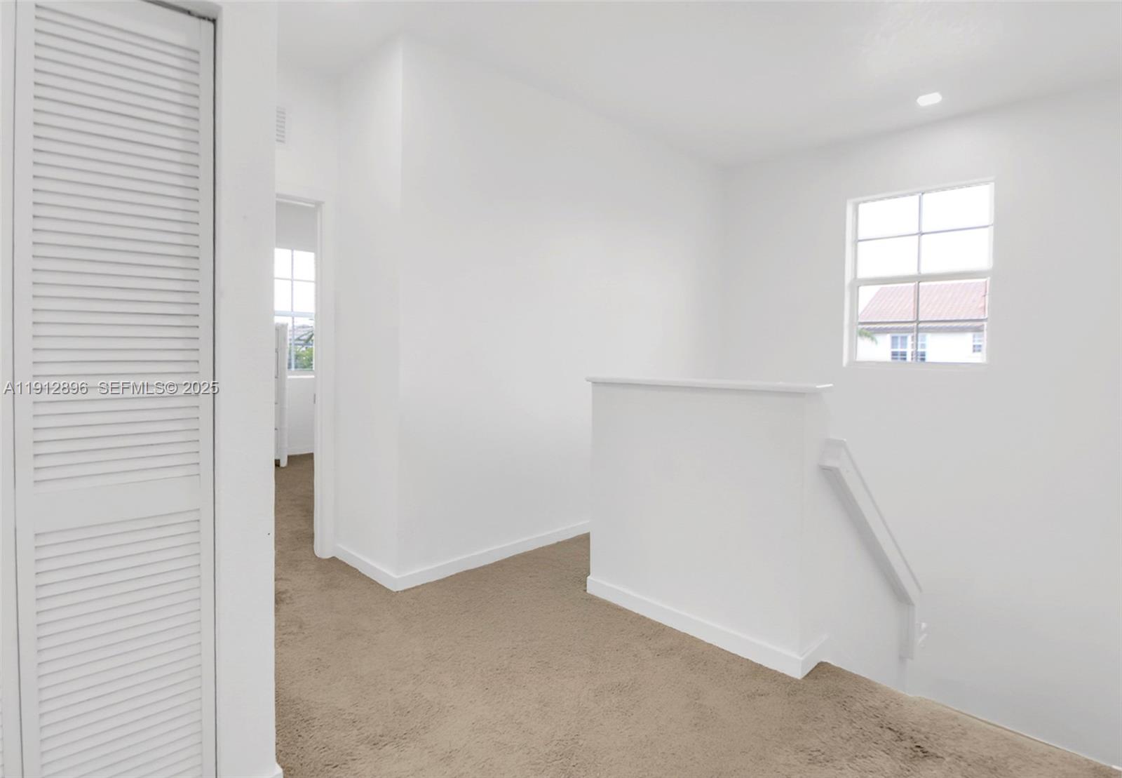 24301 Southwest 117 Path Homestead, FL 33032 - Photo 27 of 50 an empty room with windows