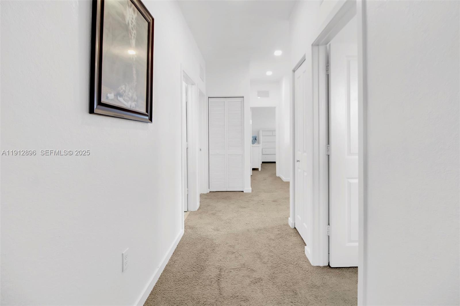 24301 Southwest 117 Path Homestead, FL 33032 - Photo 28 of 50 a view of a hallway with closet and a bathroom
