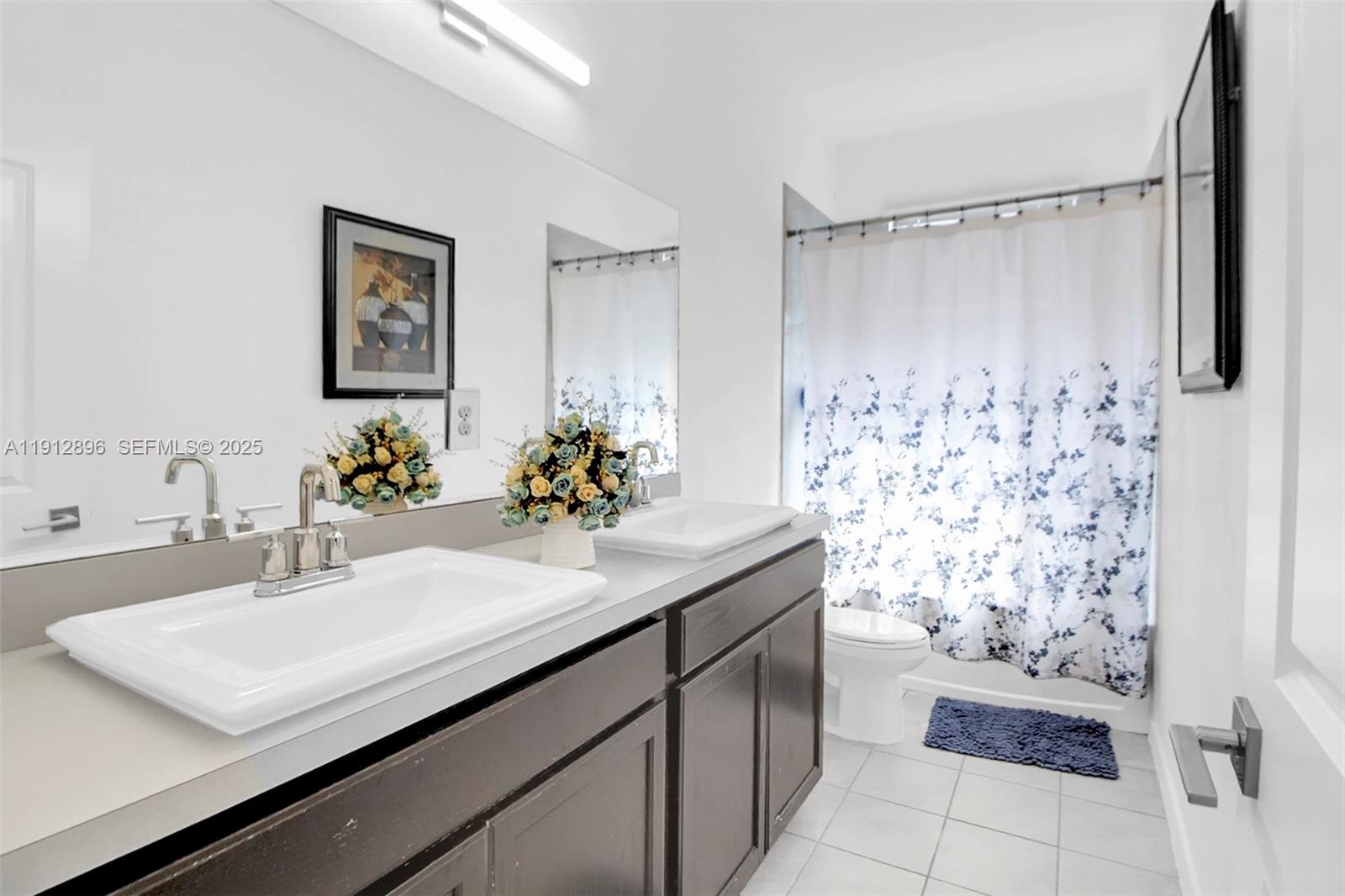 24301 Southwest 117 Path Homestead, FL 33032 - Photo 31 of 50 a bathroom with a sink and a mirror