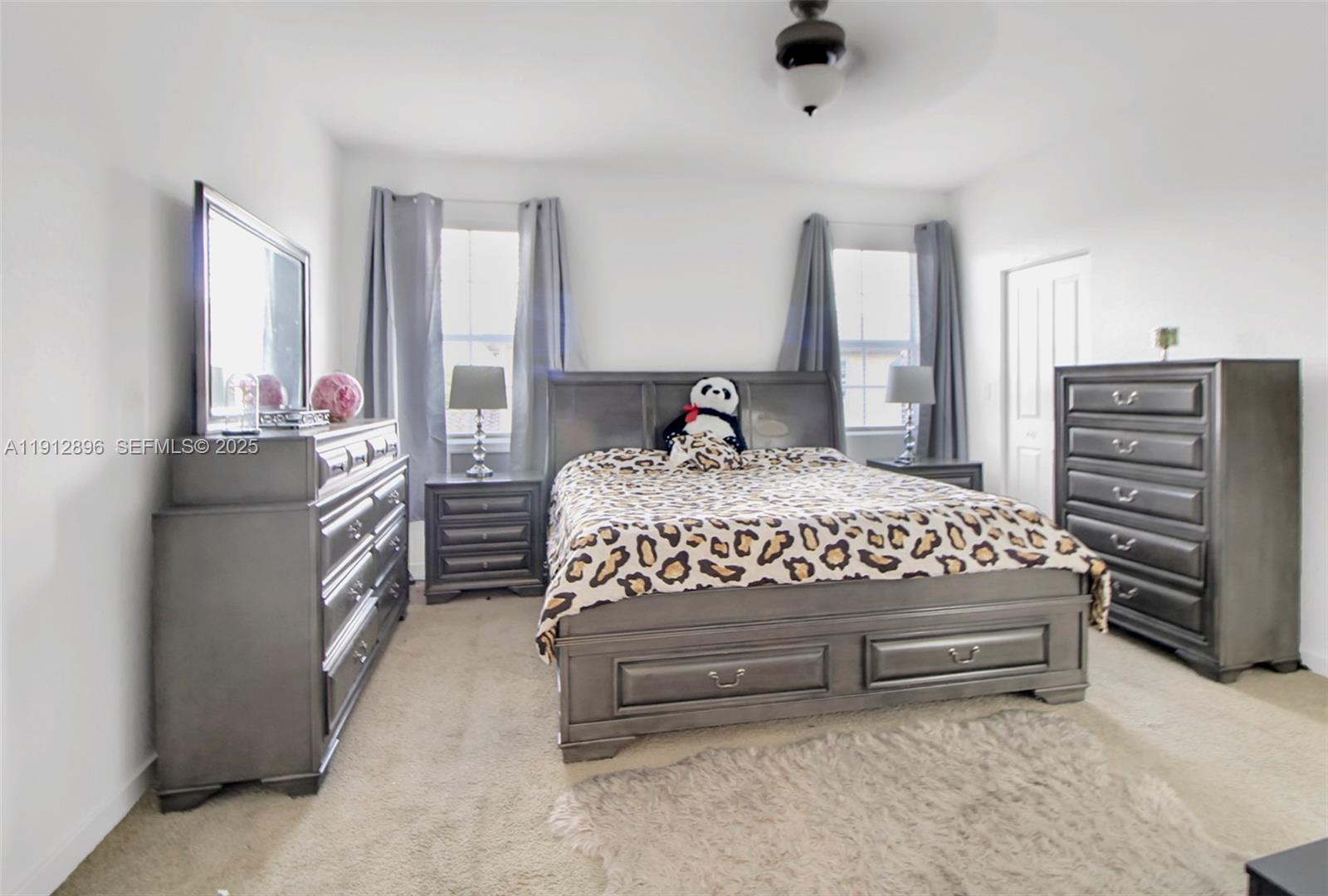 24301 Southwest 117 Path Homestead, FL 33032 - Photo 34 of 50 a bedroom with a bed and a television