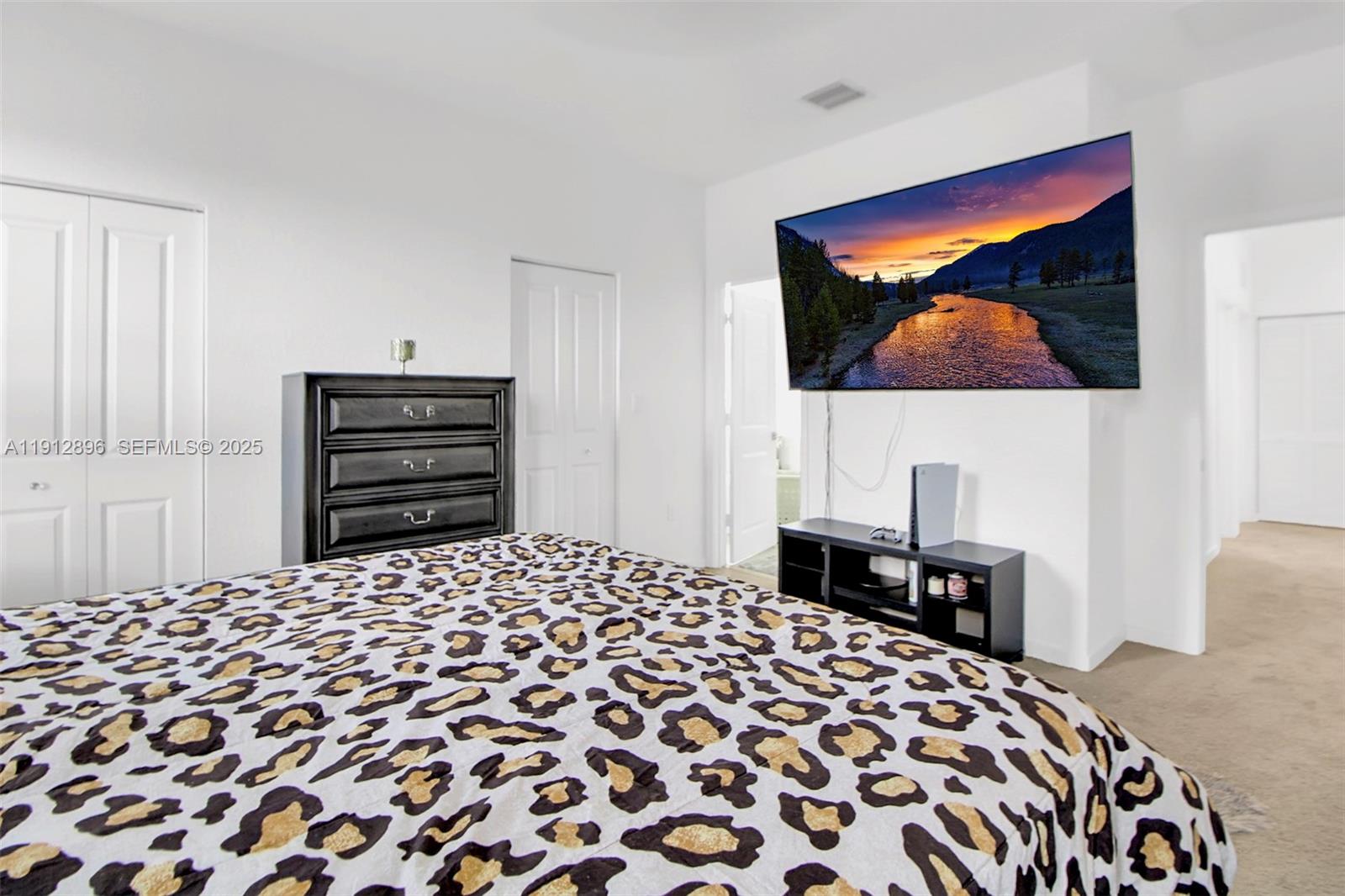 24301 Southwest 117 Path Homestead, FL 33032 - Photo 36 of 50 a bedroom with a bed and a lamp on dresser