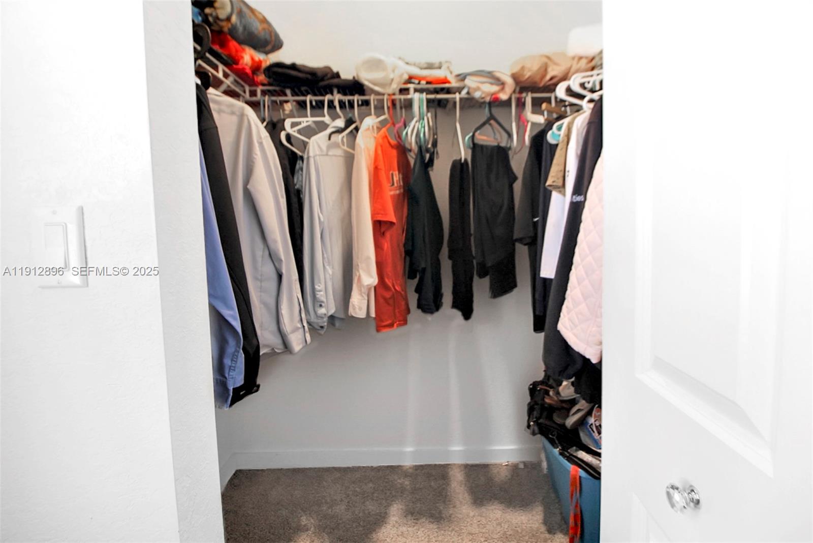 24301 Southwest 117 Path Homestead, FL 33032 - Photo 38 of 50 a view of walk in closet with clothes and shoes