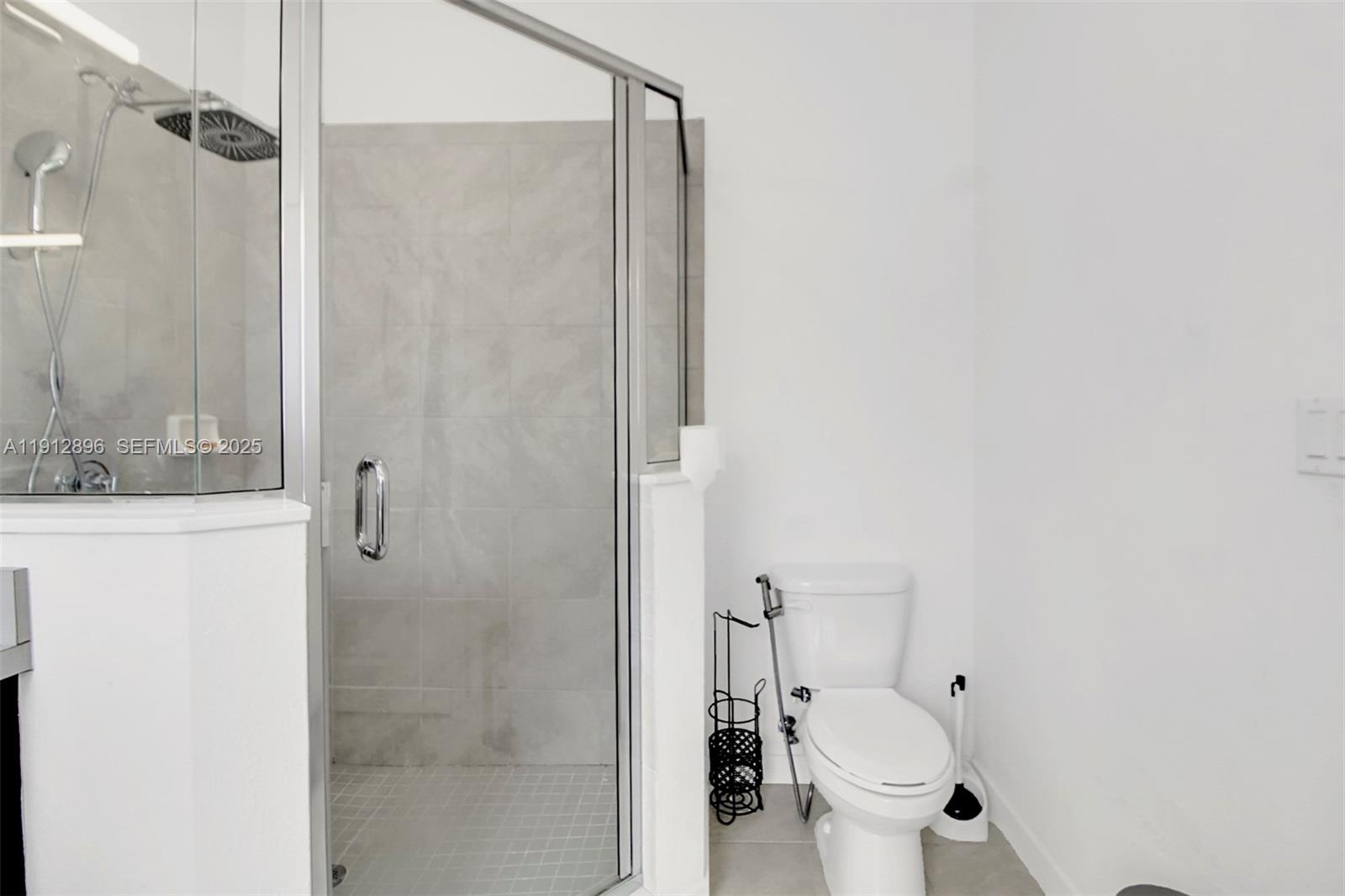 24301 Southwest 117 Path Homestead, FL 33032 - Photo 41 of 50 a bathroom with a toilet and shower