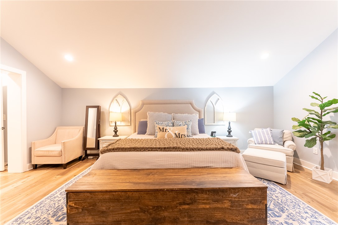 103 Riggs Drive Clemson, SC 29631 - Photo 14 of 50 Unwind in this serene bedroom sanctuary, complete with bright recessed lighting and beautiful hardwood flooring.