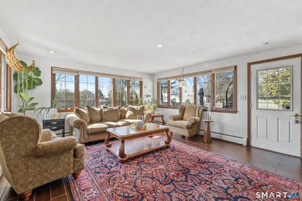 a living room with furniture and a rug