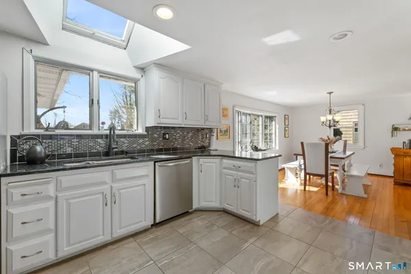 a kitchen with sink and cabinets