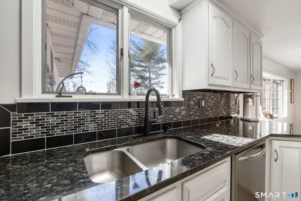 a kitchen with a sink and cabinets