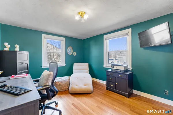 a room with furniture and a flat screen tv