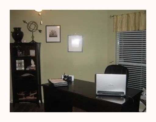 a living room with a couch and a bookshelf