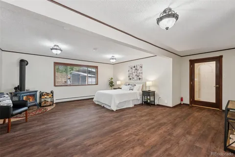 a spacious bedroom with a bed and a couch