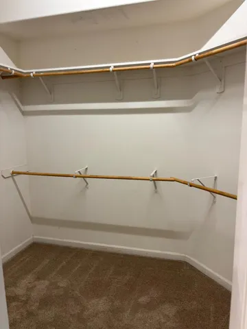 a spacious bathroom with a double vanity sink double and mirror