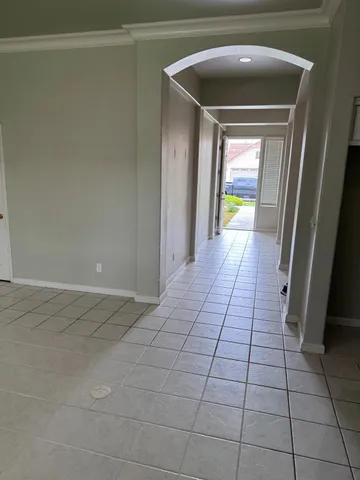 a spacious bathroom with a double vanity sink a mirror and a shower