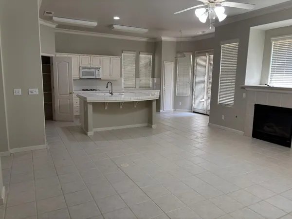 a kitchen with a sink and a mirror