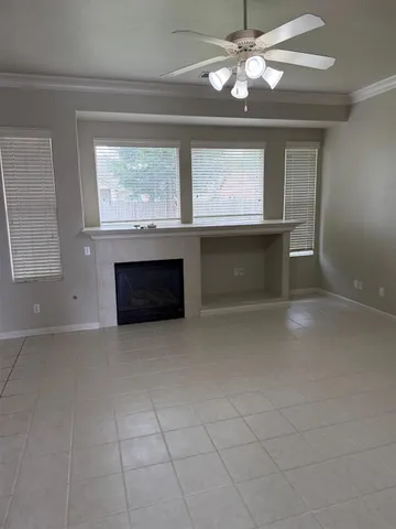 a view of a hallway with wooden cabinets