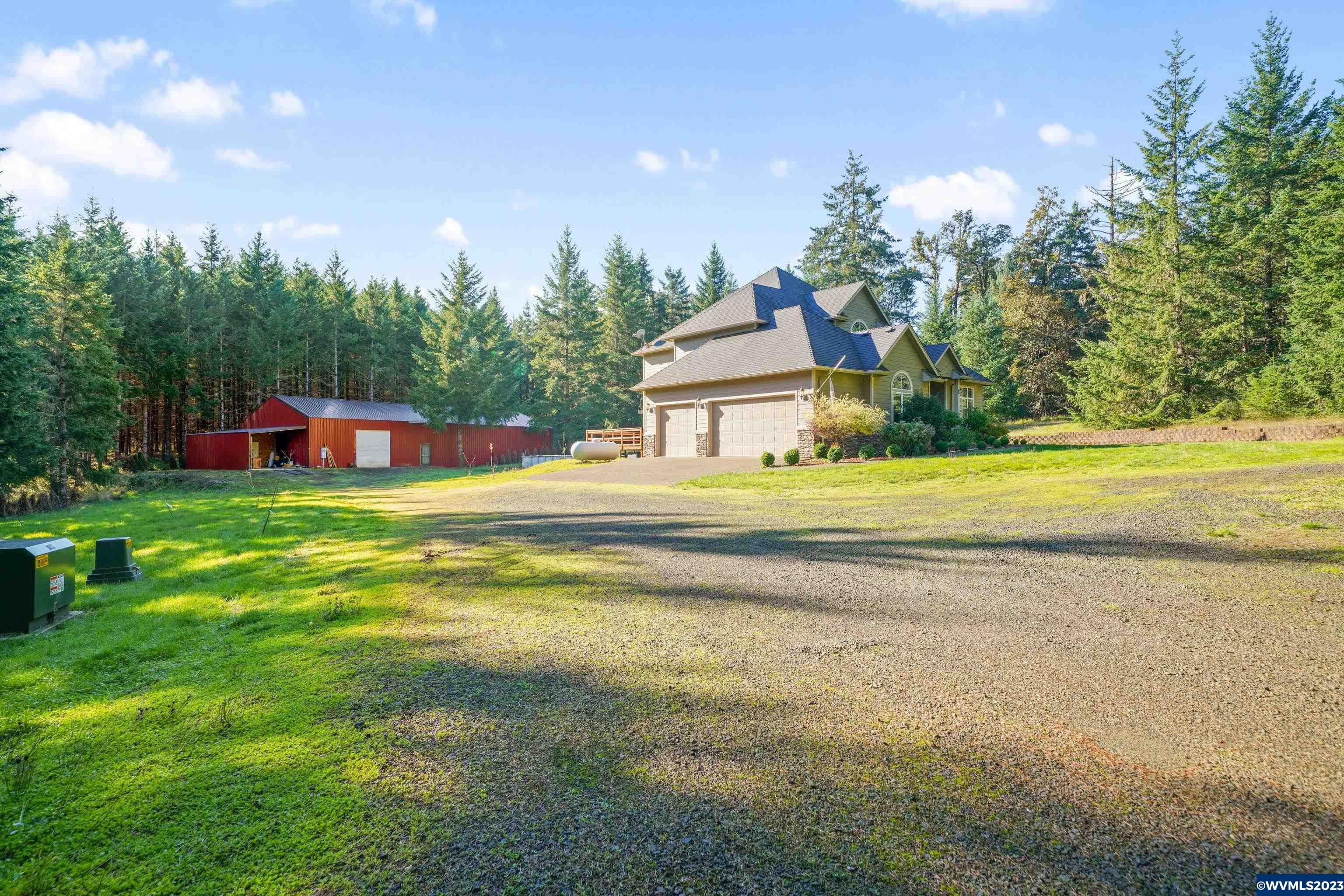 16570 Oakdale Road Dallas, OR 97338 - Photo 3 of 41 a house view with swimming pool and garden space