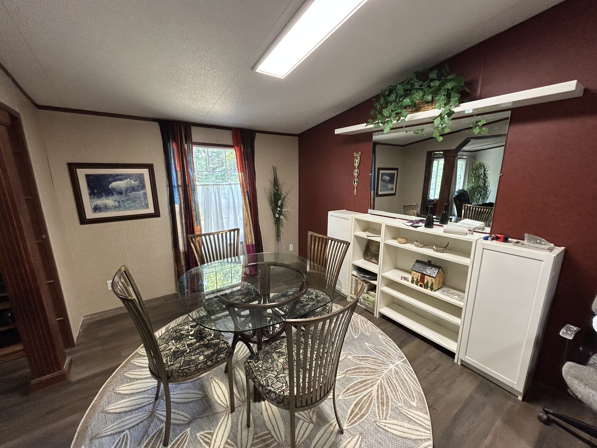 885 Sandys Camp Road Big Sandy, TN 38221 - Photo 12 of 22 a view of a dining room with furniture window and wooden floor