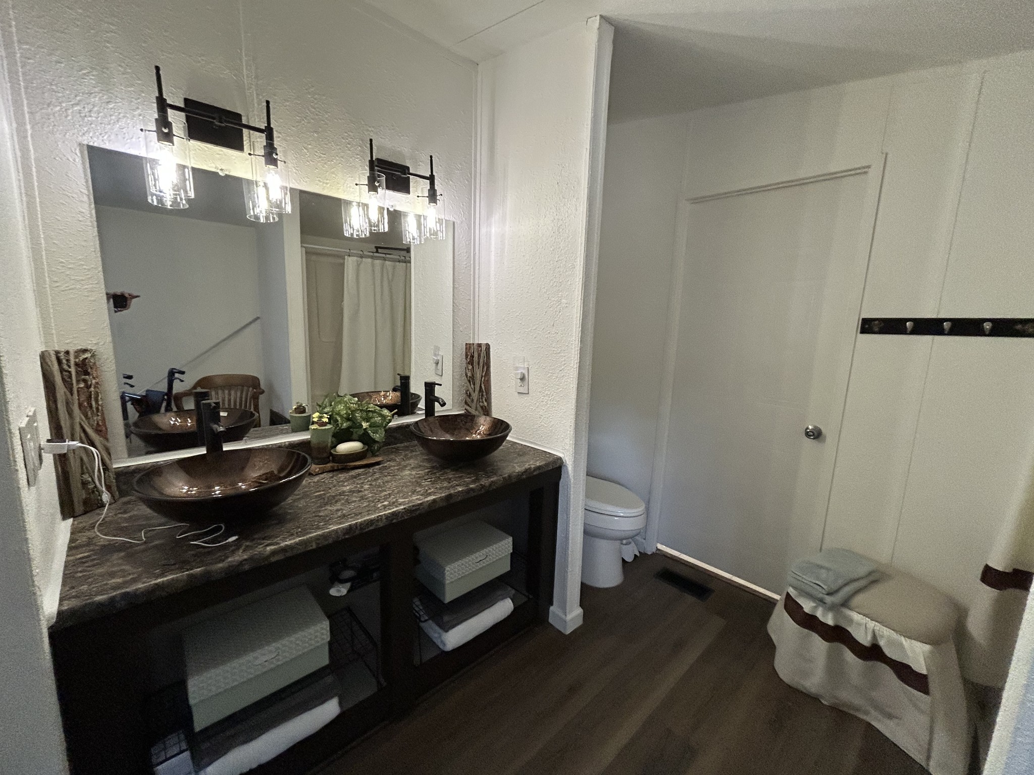 885 Sandys Camp Road Big Sandy, TN 38221 - Photo 14 of 22 a bathroom with a sink and a mirror