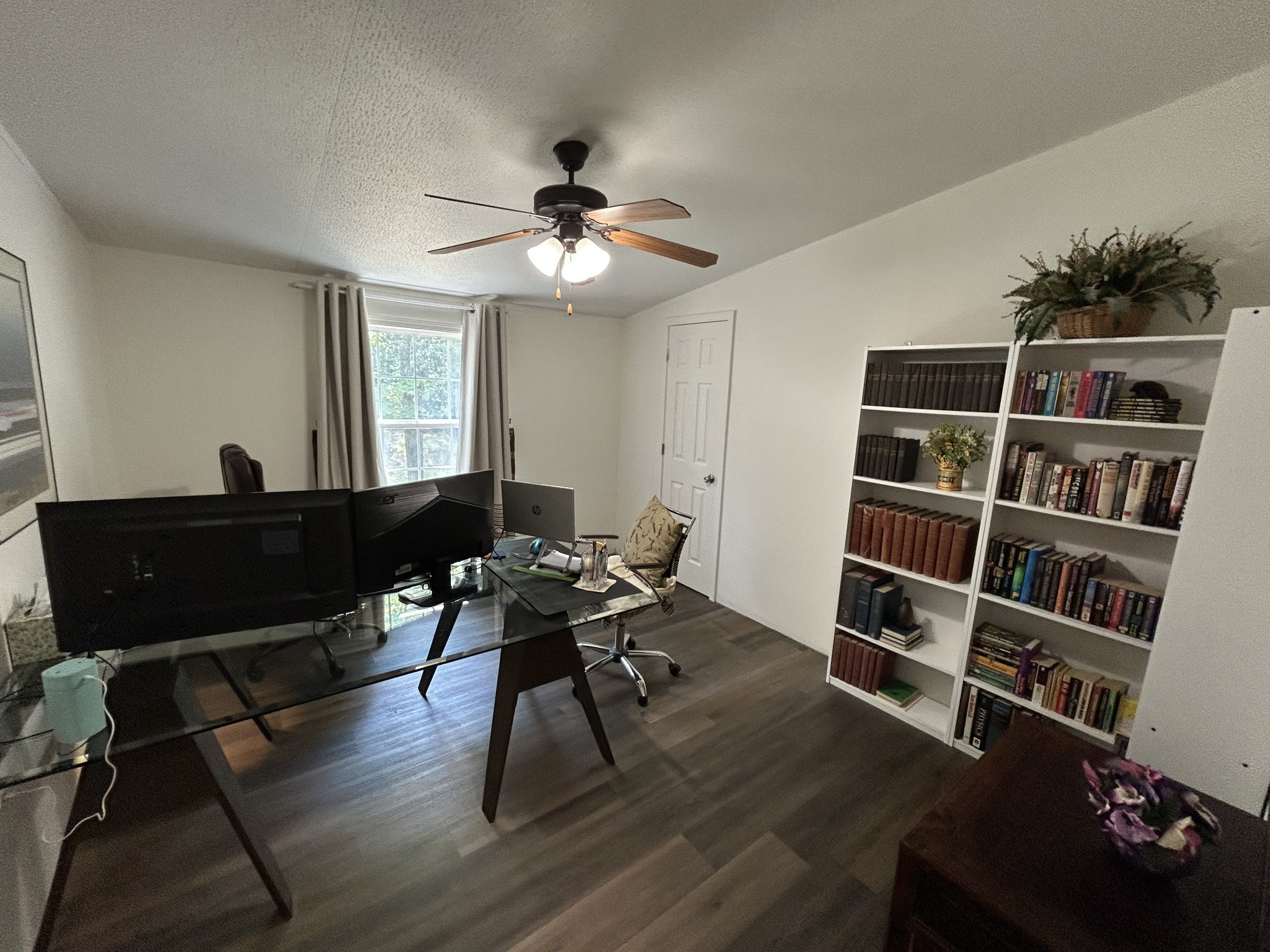885 Sandys Camp Road Big Sandy, TN 38221 - Photo 15 of 22 a view of a workspace with furniture and a bookshelf