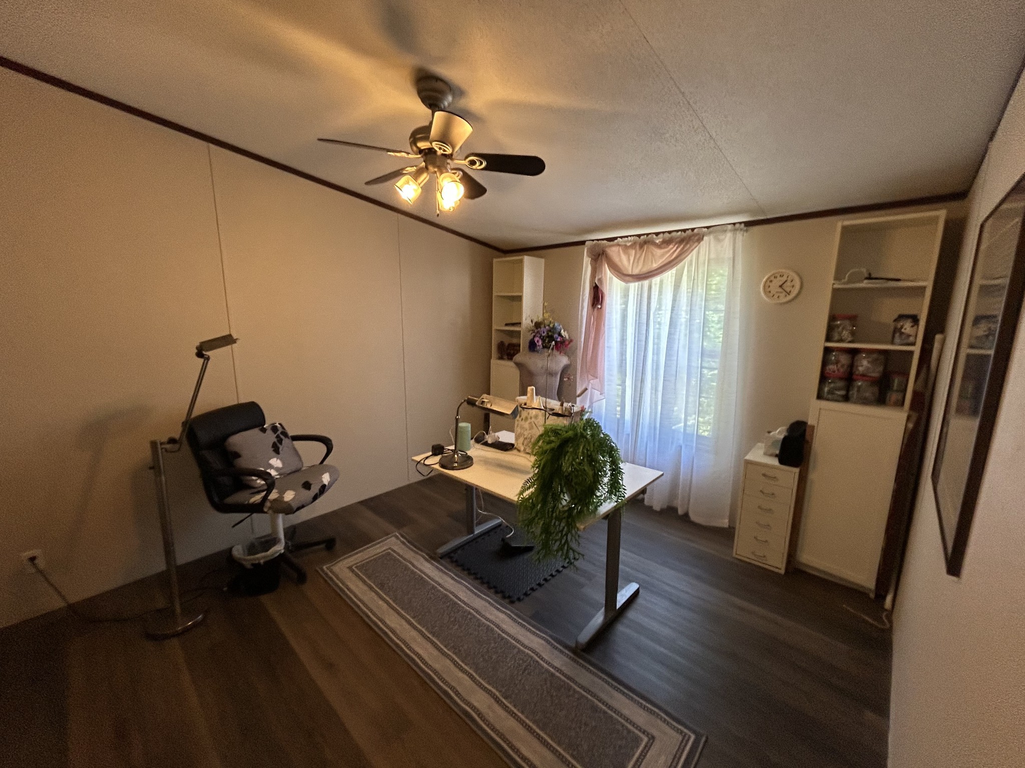 885 Sandys Camp Road Big Sandy, TN 38221 - Photo 16 of 22 a living room with furniture and a chandelier
