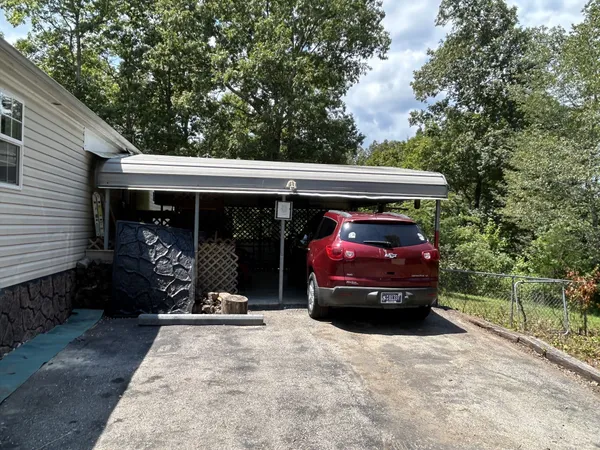 a view of a car in front of a house