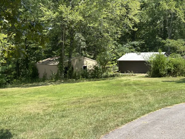 a swimming pool with trees in the background