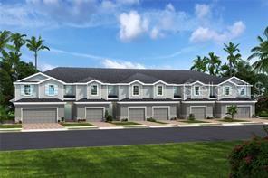 a front view of houses with yard