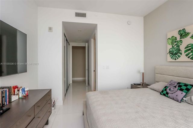 a view of a balcony with a yard