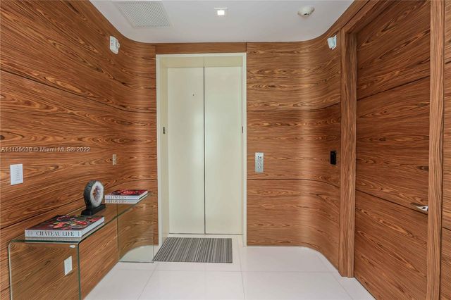 a view of a hallway with front door