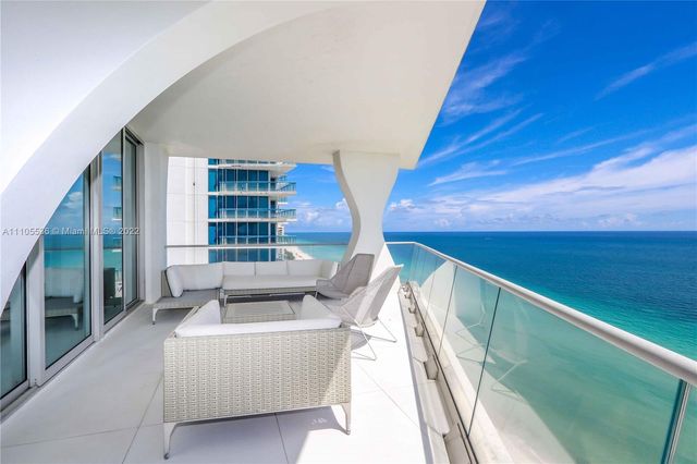 a balcony with seating space