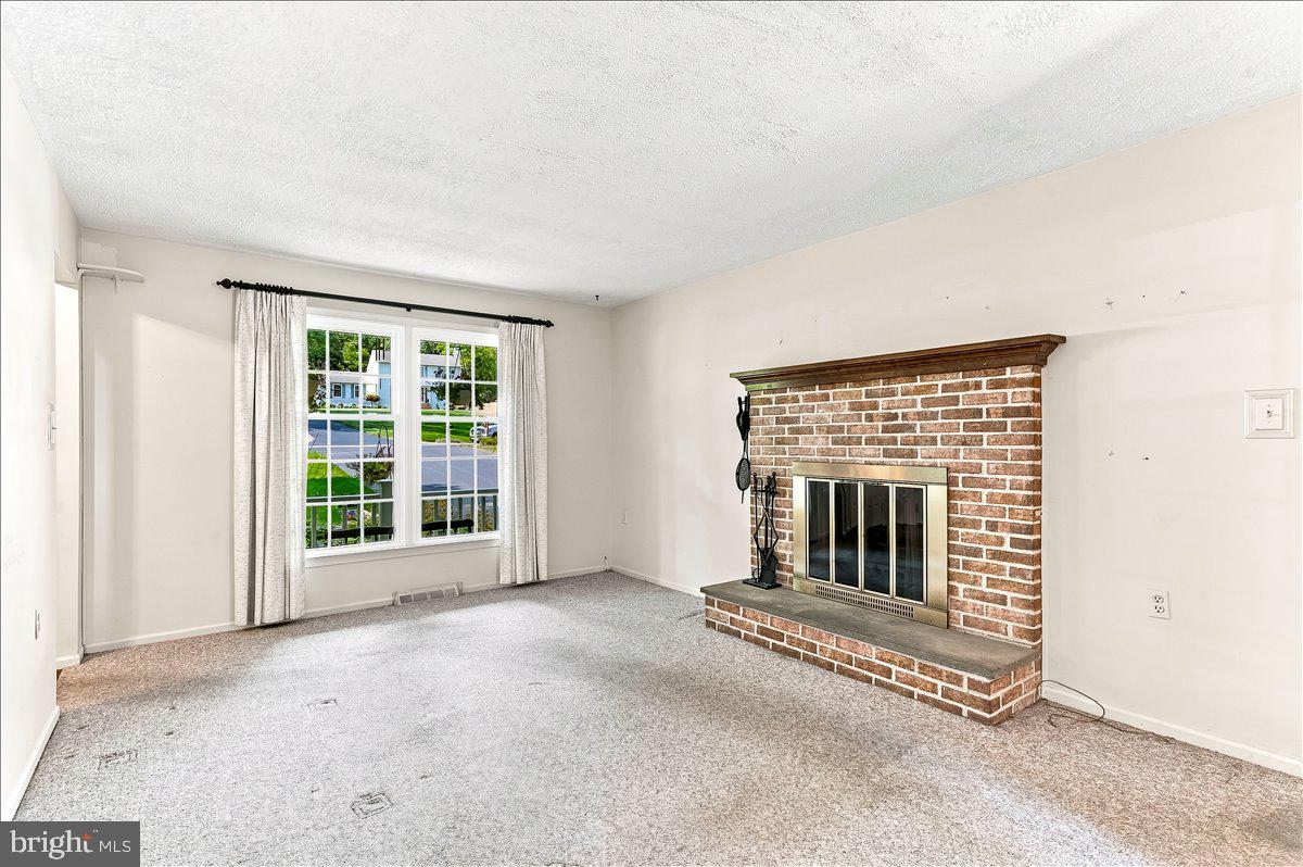 98 Cambridge Road Elkton, MD 21921 - Photo 13 of 48 Family room with Brick Fireplace