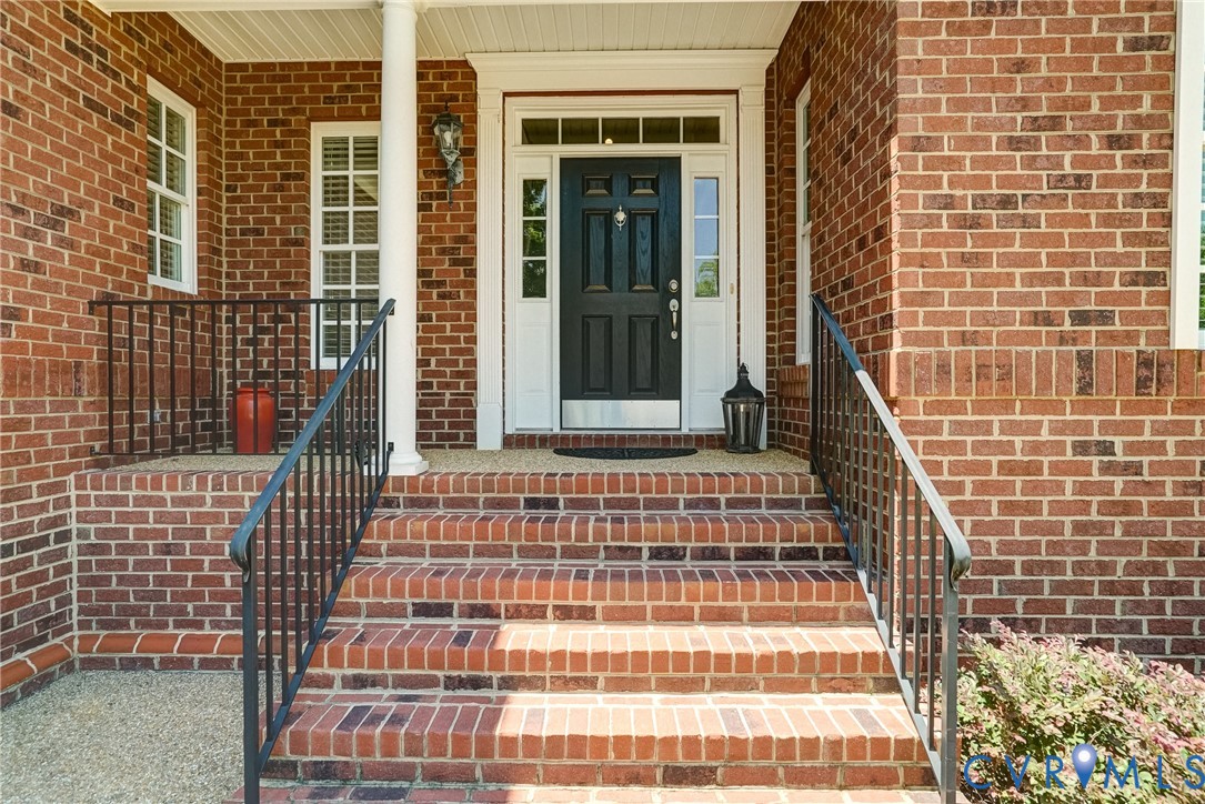 3606 Edenfield Road Midlothian, VA 23113 - Photo 6 of 67 Brick facade with a covered entry, featuring a dar