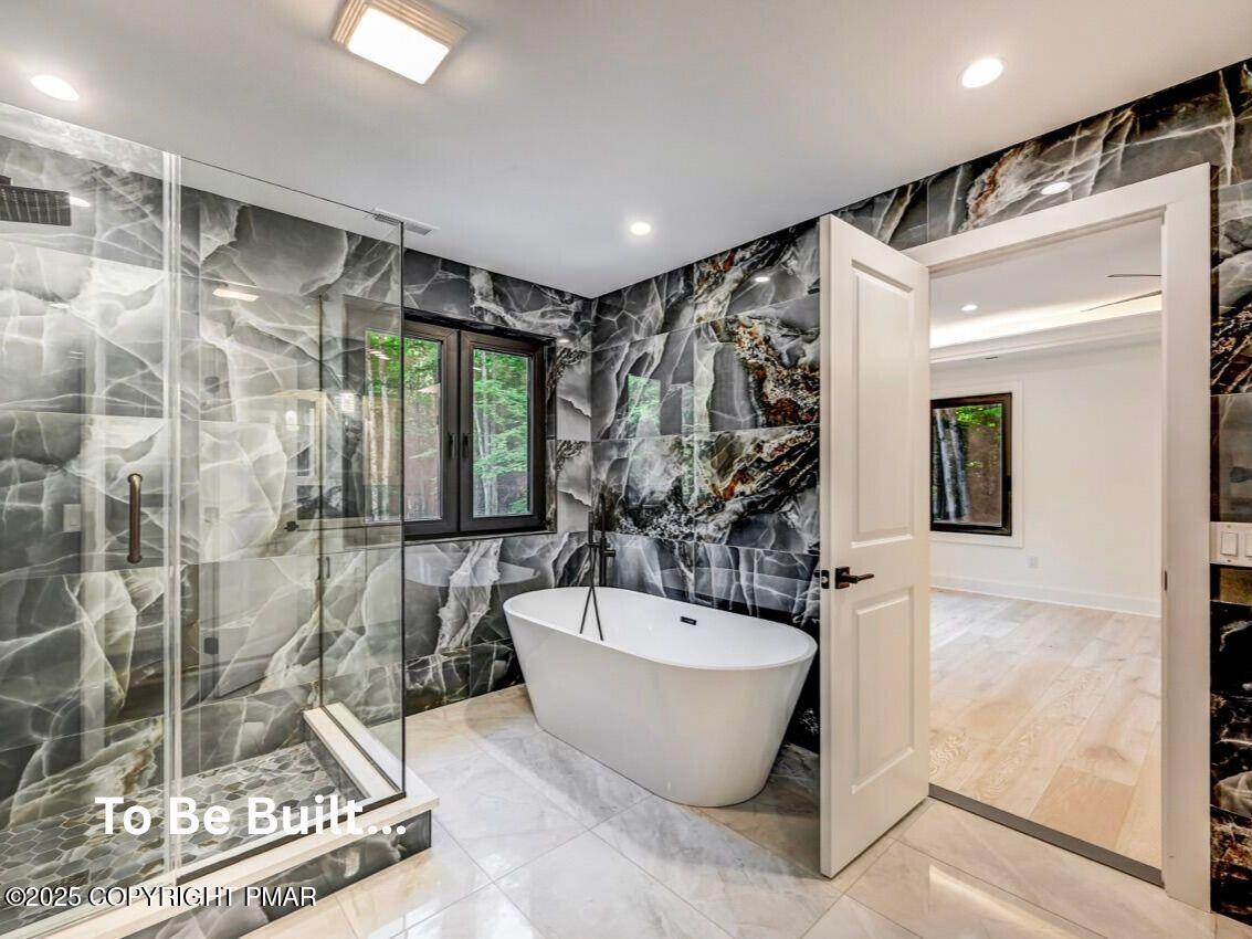 8-7 Sweet Briar Road Pocono Pines, PA 18350 - Photo 12 of 38 a spacious bathroom with a bathtub and shower