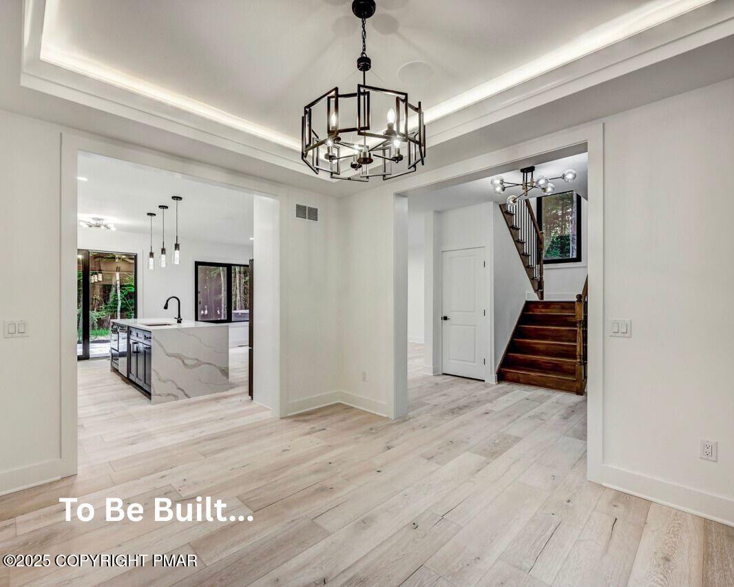 8-7 Sweet Briar Road Pocono Pines, PA 18350 - Photo 8 of 38 a view of a livingroom with wooden floor and a kitchen space