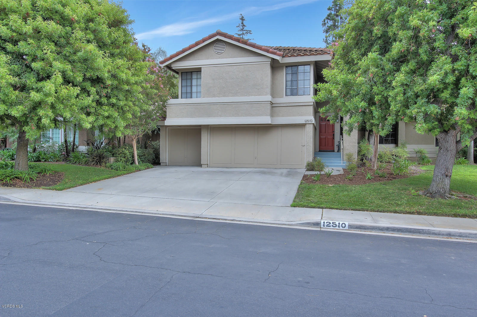 12510 Crystal Ranch Road Moorpark, CA 93021 - Photo 1 of 43 a front view of a house with a yard and garage