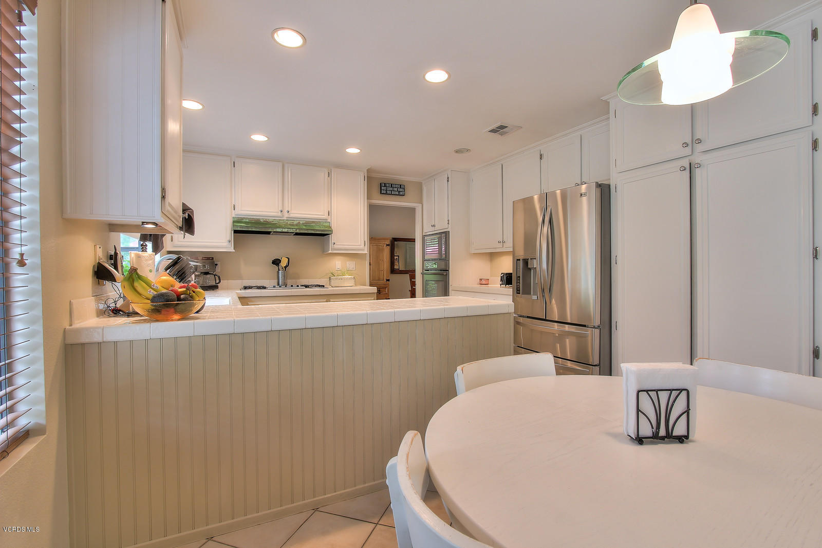 12510 Crystal Ranch Road Moorpark, CA 93021 - Photo 14 of 43 a kitchen with stainless steel appliances a refrigerator and a sink