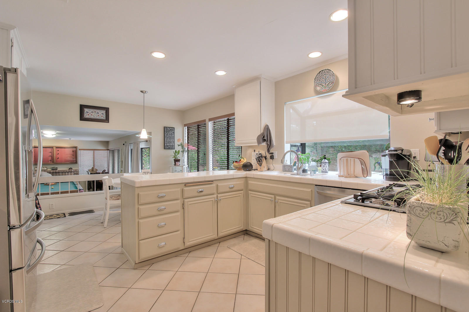 12510 Crystal Ranch Road Moorpark, CA 93021 - Photo 16 of 43 a kitchen with sink cabinets and stove