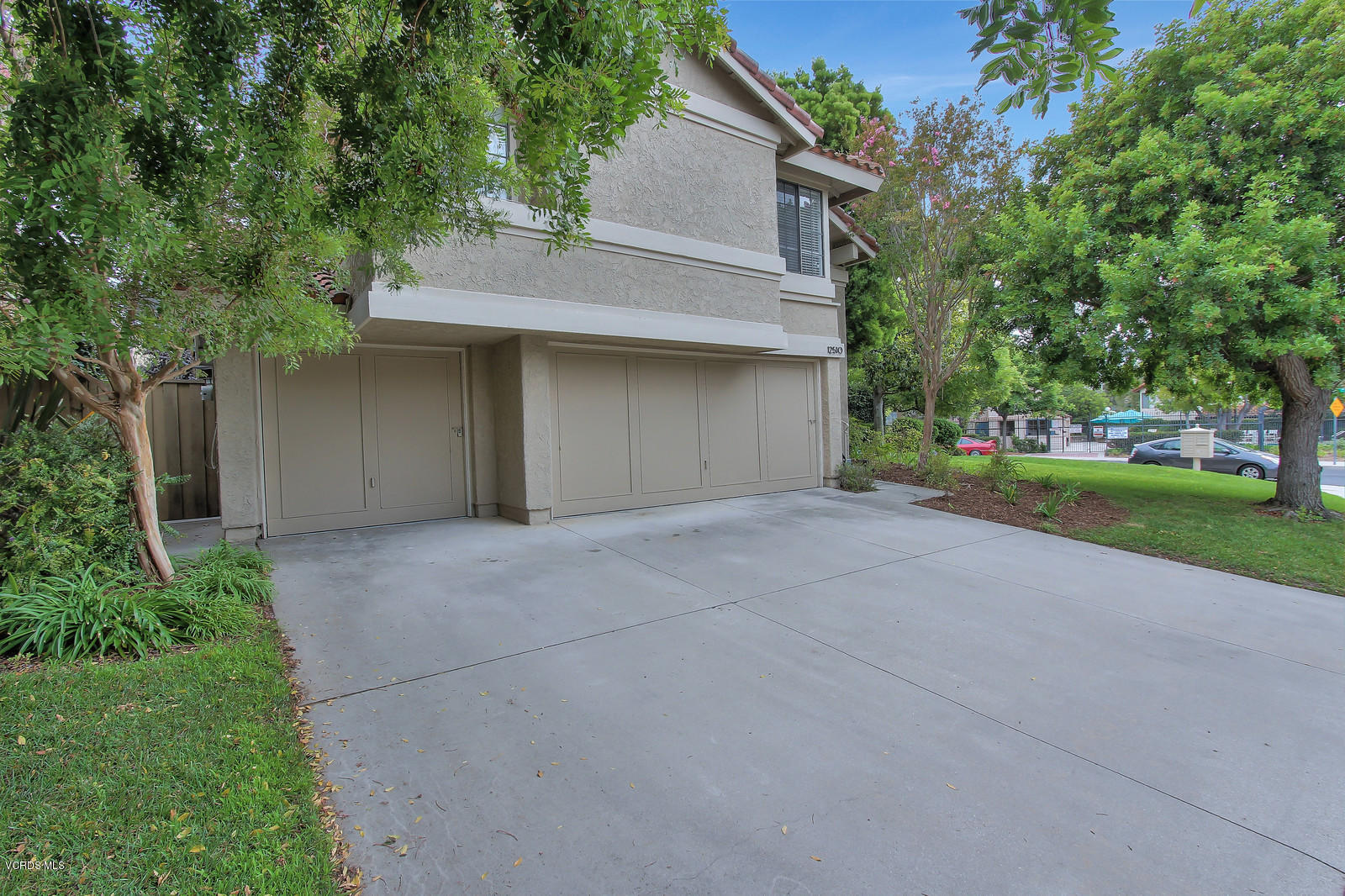 12510 Crystal Ranch Road Moorpark, CA 93021 - Photo 3 of 43 a front view of a house with a yard and garage