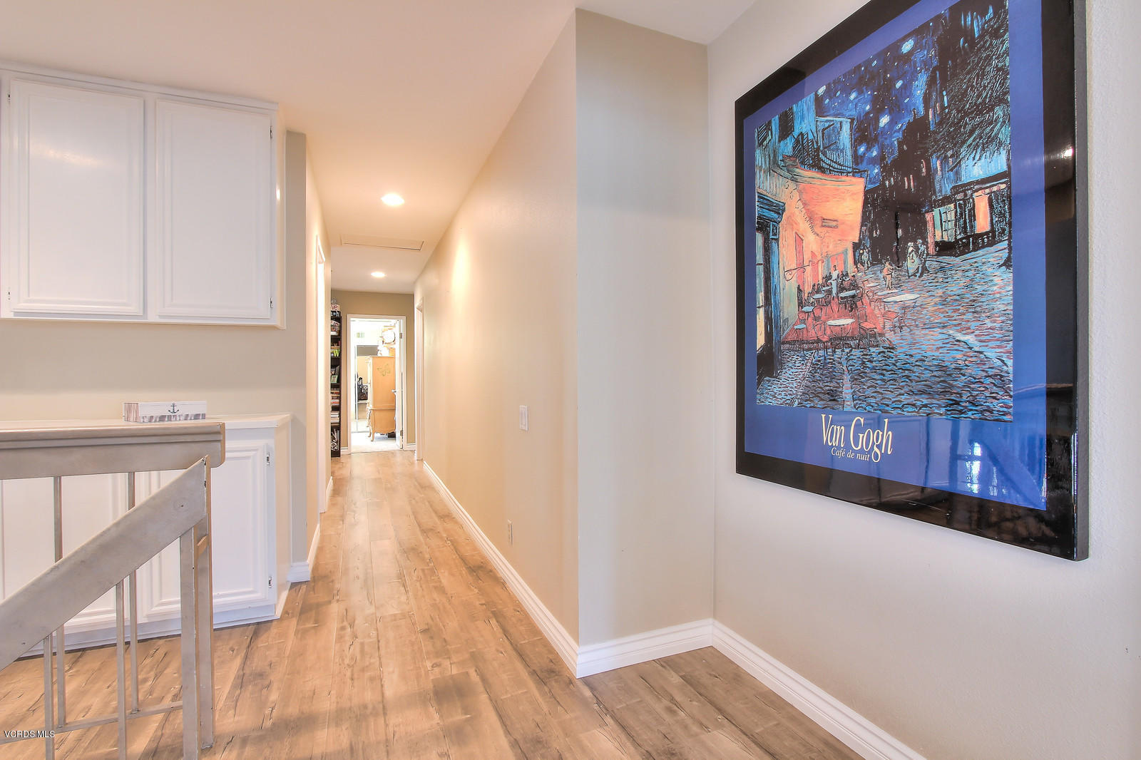 12510 Crystal Ranch Road Moorpark, CA 93021 - Photo 24 of 43 a view of a hallway with wooden floor and doors