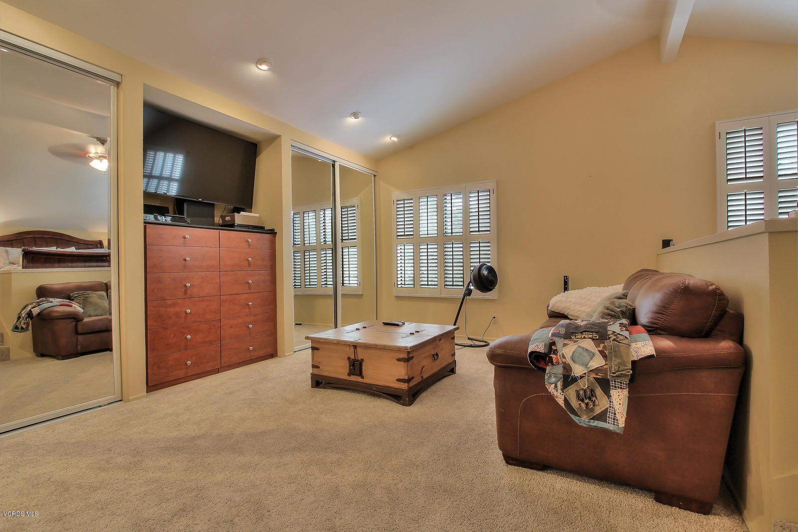 12510 Crystal Ranch Road Moorpark, CA 93021 - Photo 27 of 43 a living room with furniture gym equipment and a large window