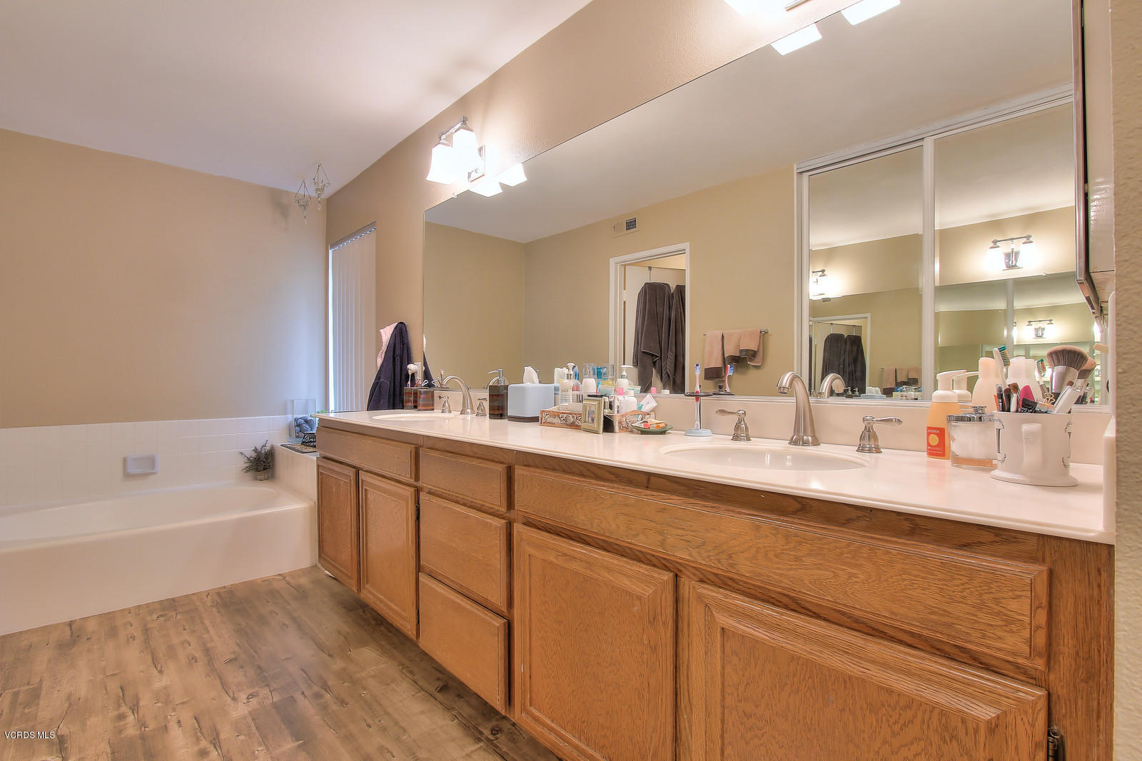 12510 Crystal Ranch Road Moorpark, CA 93021 - Photo 29 of 43 a bathroom with a tub sink and mirror
